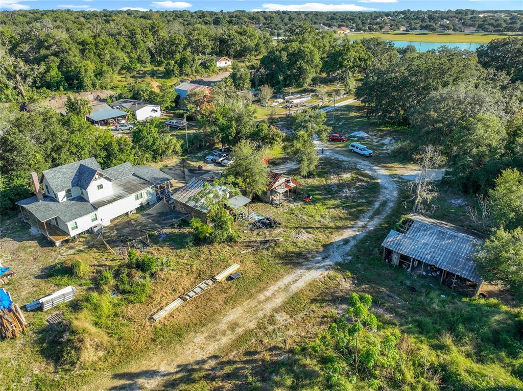 7717 Clarcona Ocoee Road Orlando, FL 32818 - Photo 44 of 63 an aerial view of residential house with outdoor space and swimming pool
