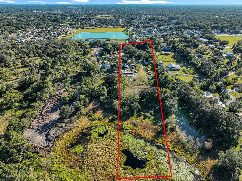 7717 Clarcona Ocoee Road Orlando, FL 32818 - Photo 61 of 63 an aerial view of residential houses with outdoor space