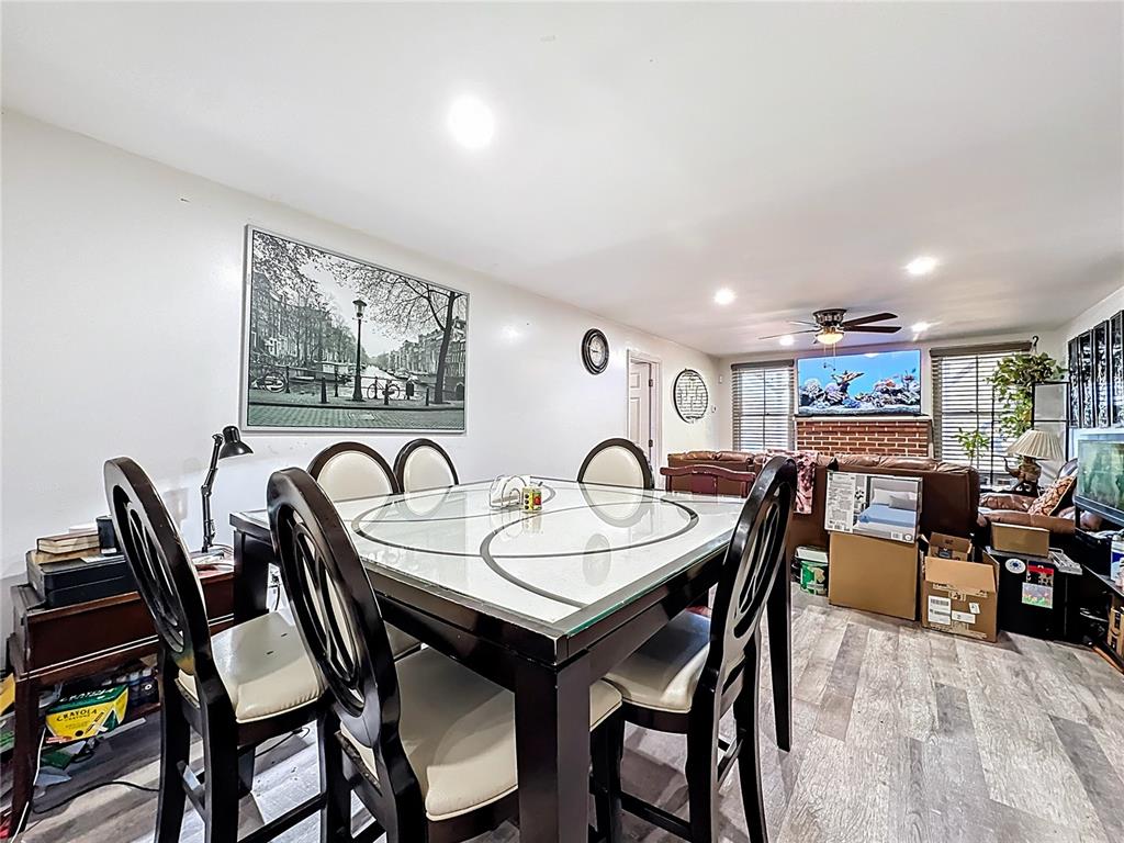 7717 Clarcona Ocoee Road Orlando, FL 32818 - Photo 10 of 63 a view of a dining room and livingroom with furniture