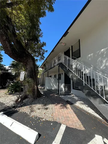 a view of street along with trees