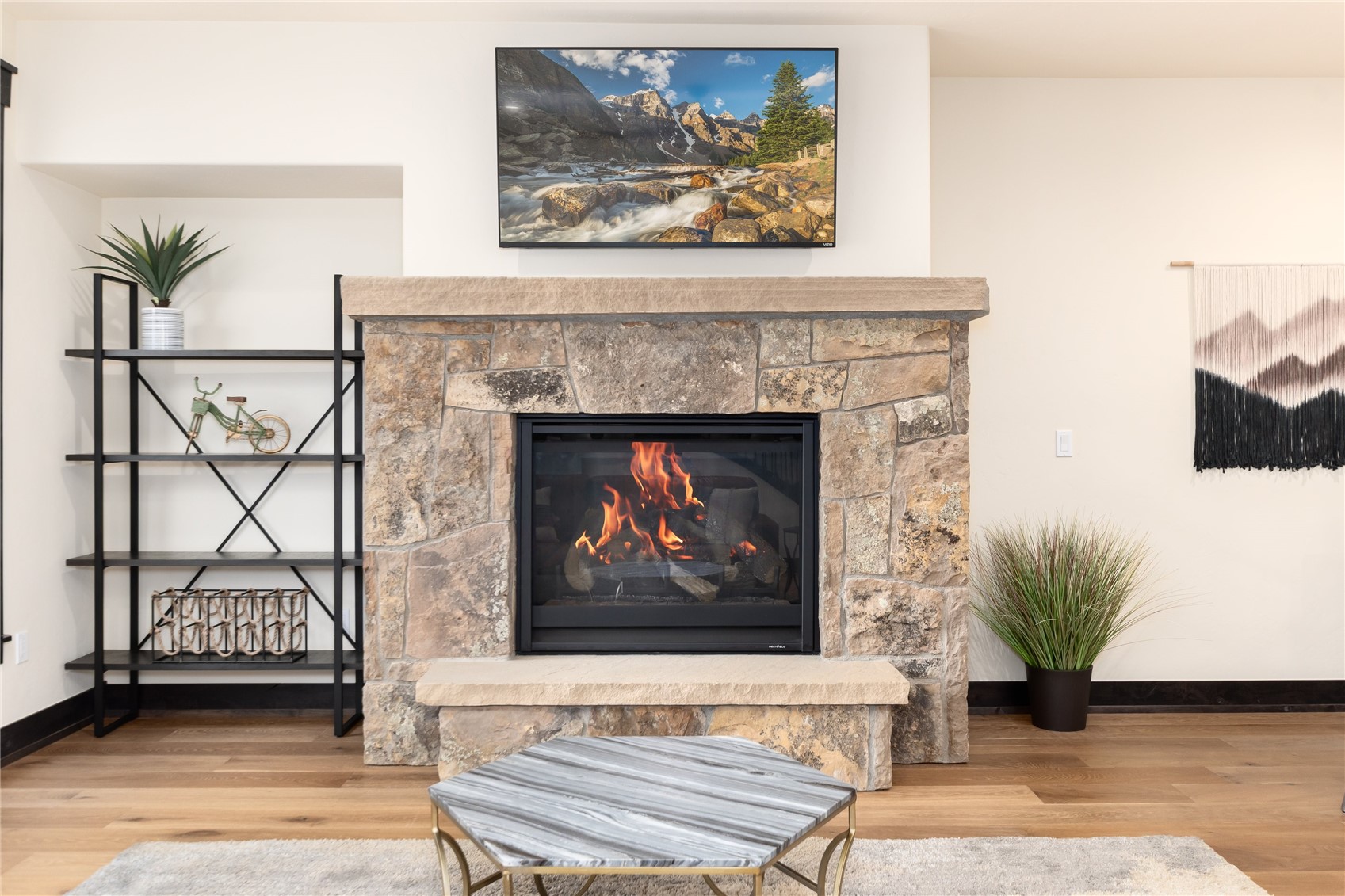 750 Independence Road, Unit 2C Keystone, CO 80435 - Photo 9 of 49 Gas fireplace with beautiful stonework
