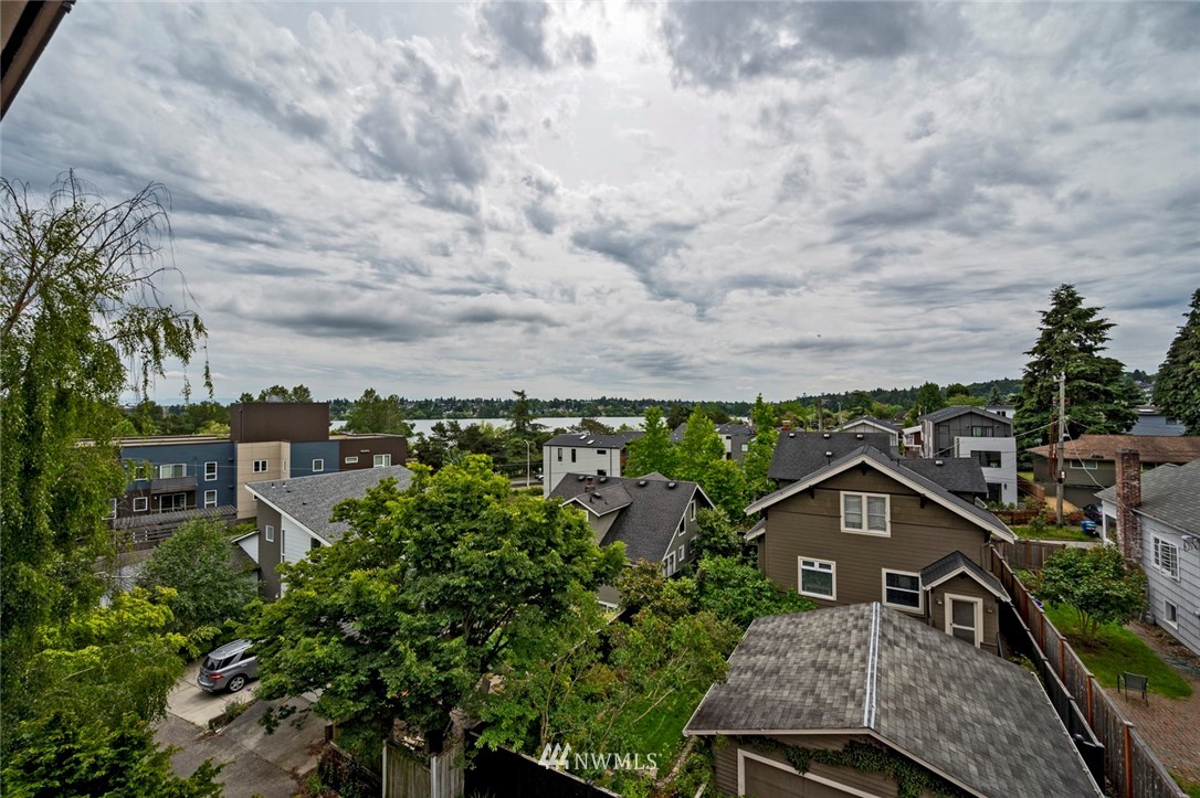 911 North 73rd Street, Unit 407 Seattle, WA 98103 - Photo 14 of 27 an aerial view of multiple houses with a yard