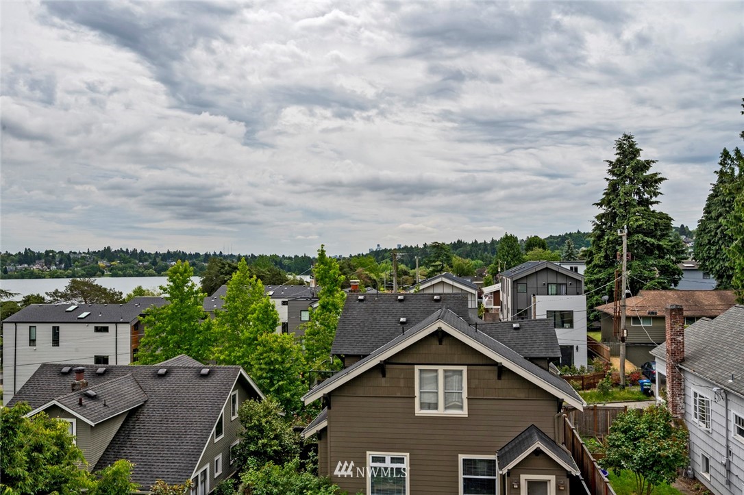 911 North 73rd Street, Unit 407 Seattle, WA 98103 - Photo 16 of 27 a view of a house with a yard