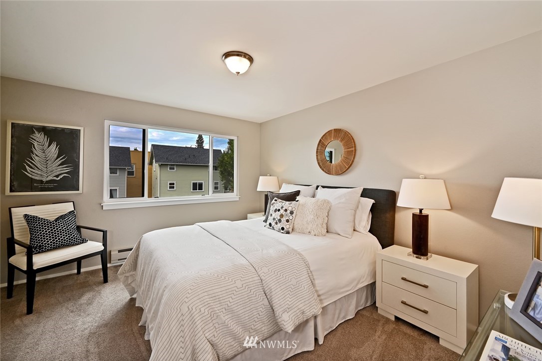 911 North 73rd Street, Unit 407 Seattle, WA 98103 - Photo 18 of 27 a bedroom with a bed and window