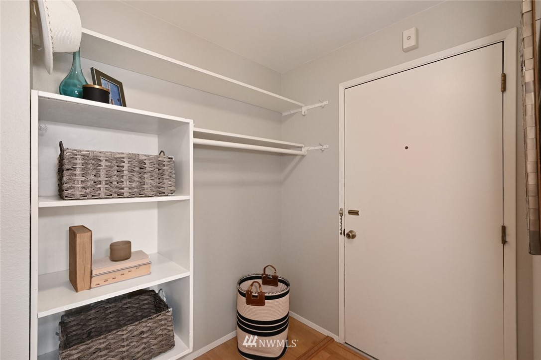 911 North 73rd Street, Unit 407 Seattle, WA 98103 - Photo 22 of 27 a bathroom with a sink and a mirror