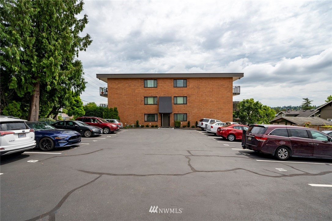 911 North 73rd Street, Unit 407 Seattle, WA 98103 - Photo 24 of 27 a view of car parked in front of a house