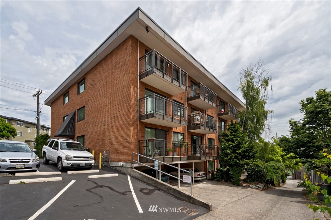 911 North 73rd Street, Unit 407 Seattle, WA 98103 - Photo 4 of 27 a view of a street with cars