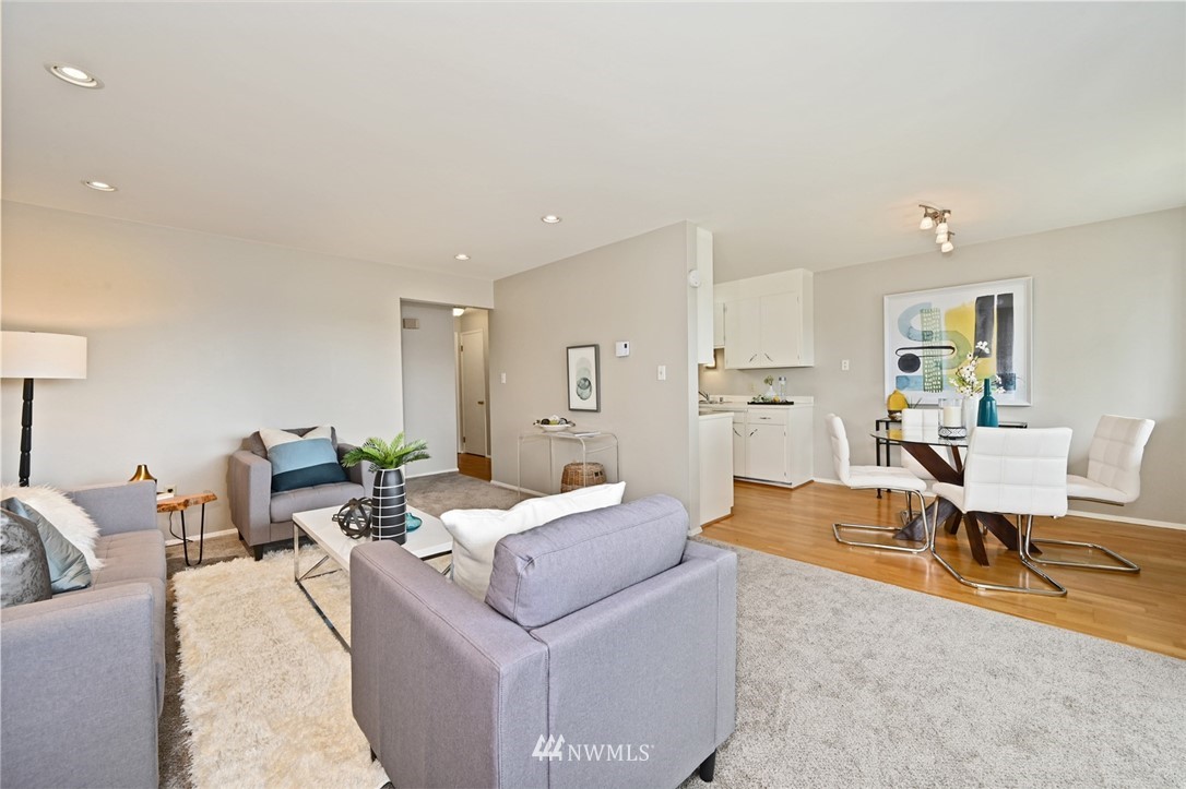 911 North 73rd Street, Unit 407 Seattle, WA 98103 - Photo 6 of 27 a living room with furniture and a table