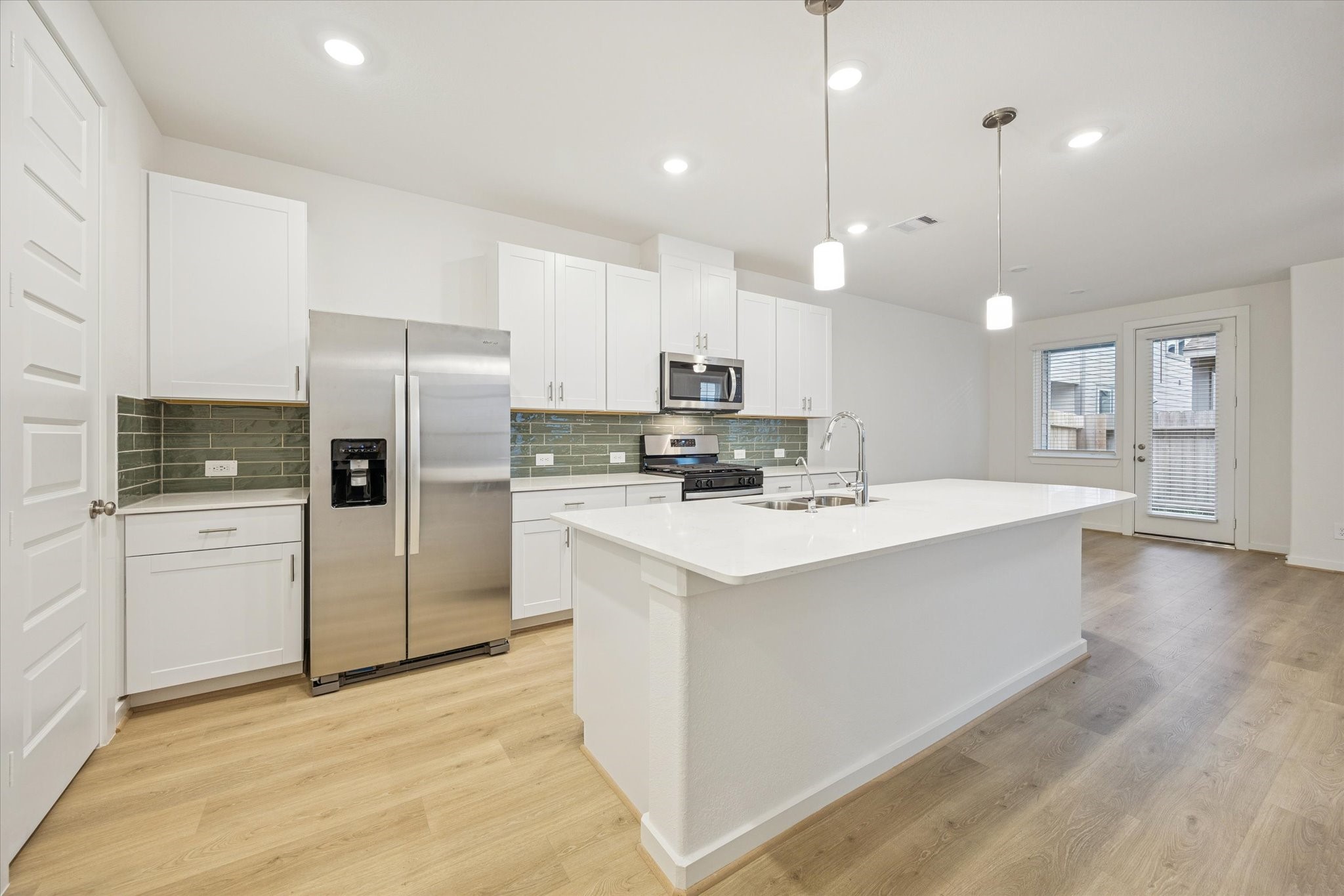 4113 Fig Grv Street Houston, TX 77080 - Photo 4 of 22 The kitchen offers an oversized island, gas stove, pantry, and plenty of cabinet space.