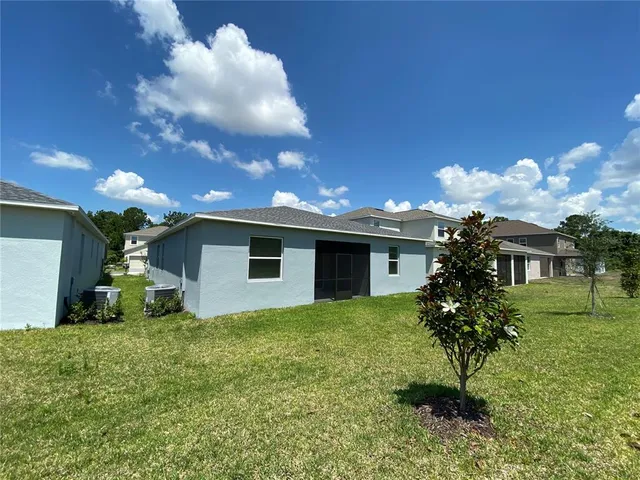 a view of a house with a yard