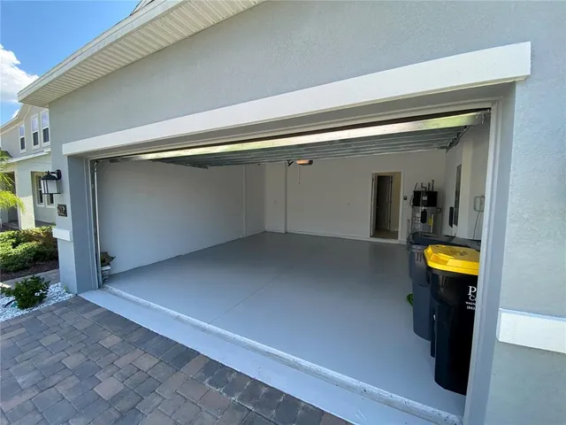 a view of a hallway with wooden walls and a potted plant