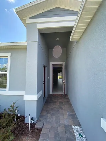a view of a hallway to a house
