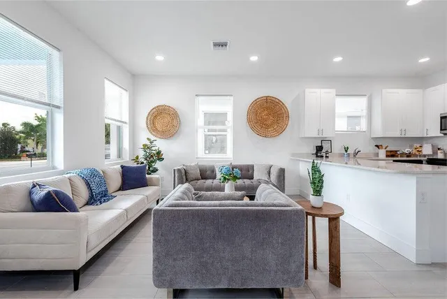 a living room with furniture and a large window