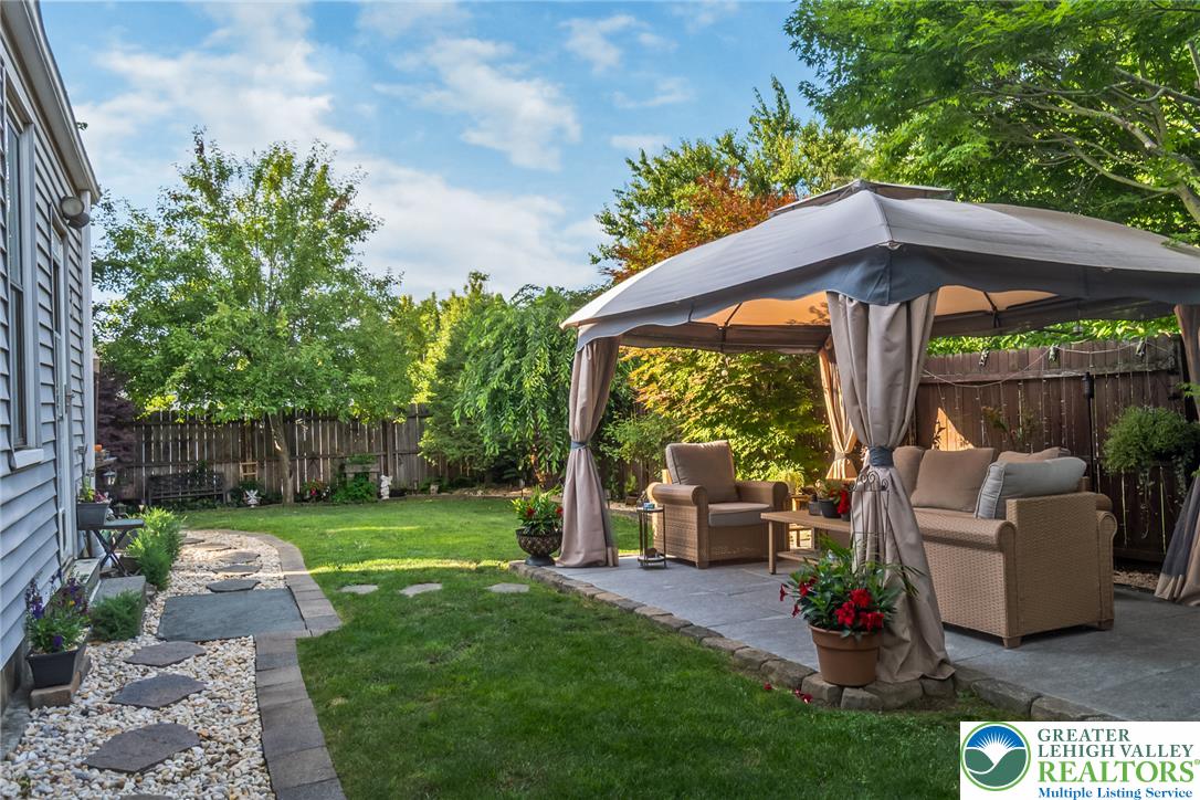 365 Rock Street Easton, PA 18042 - Photo 41 of 50 A private outdoor living space with a covered patio offers ample room for relaxation and entertaining.