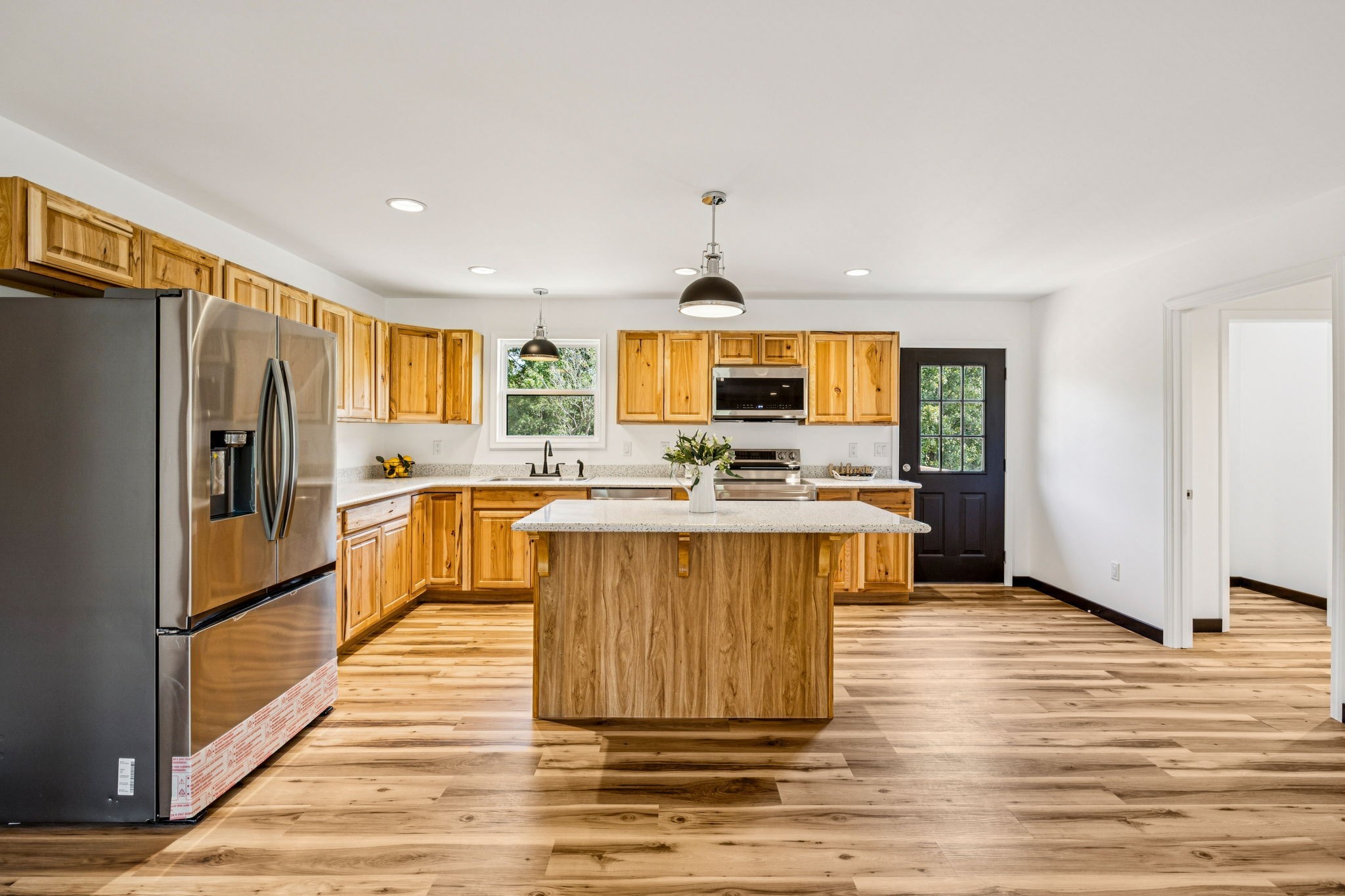 233 Ralph Spivey Lane Gainesboro, TN 38562 - Photo 14 of 45 a kitchen with stainless steel appliances a refrigerator stove top oven and sink