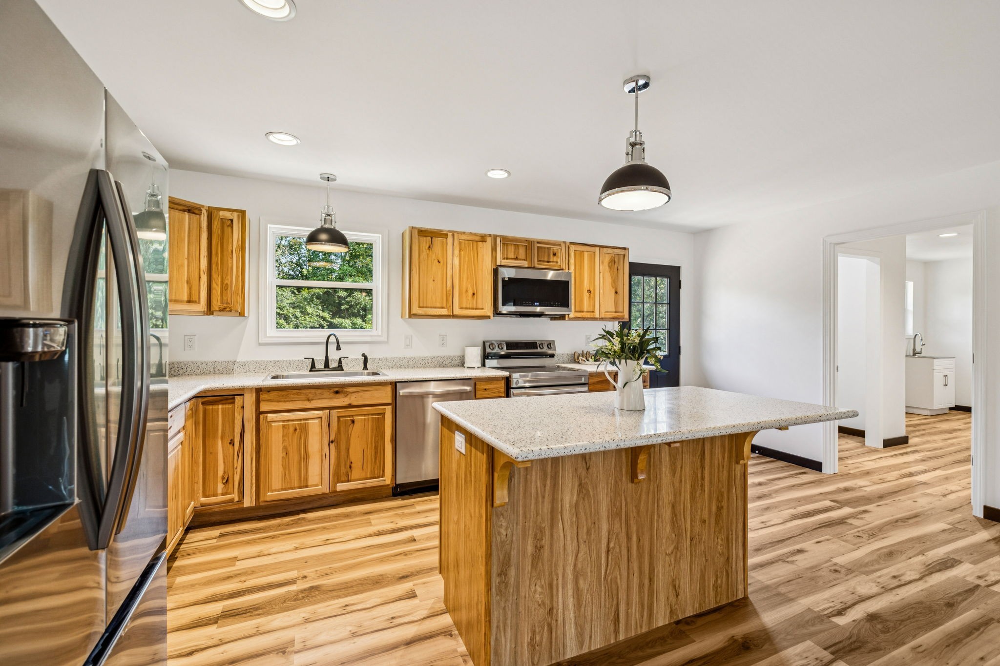 233 Ralph Spivey Lane Gainesboro, TN 38562 - Photo 15 of 45 a kitchen with stainless steel appliances a sink stove and refrigerator