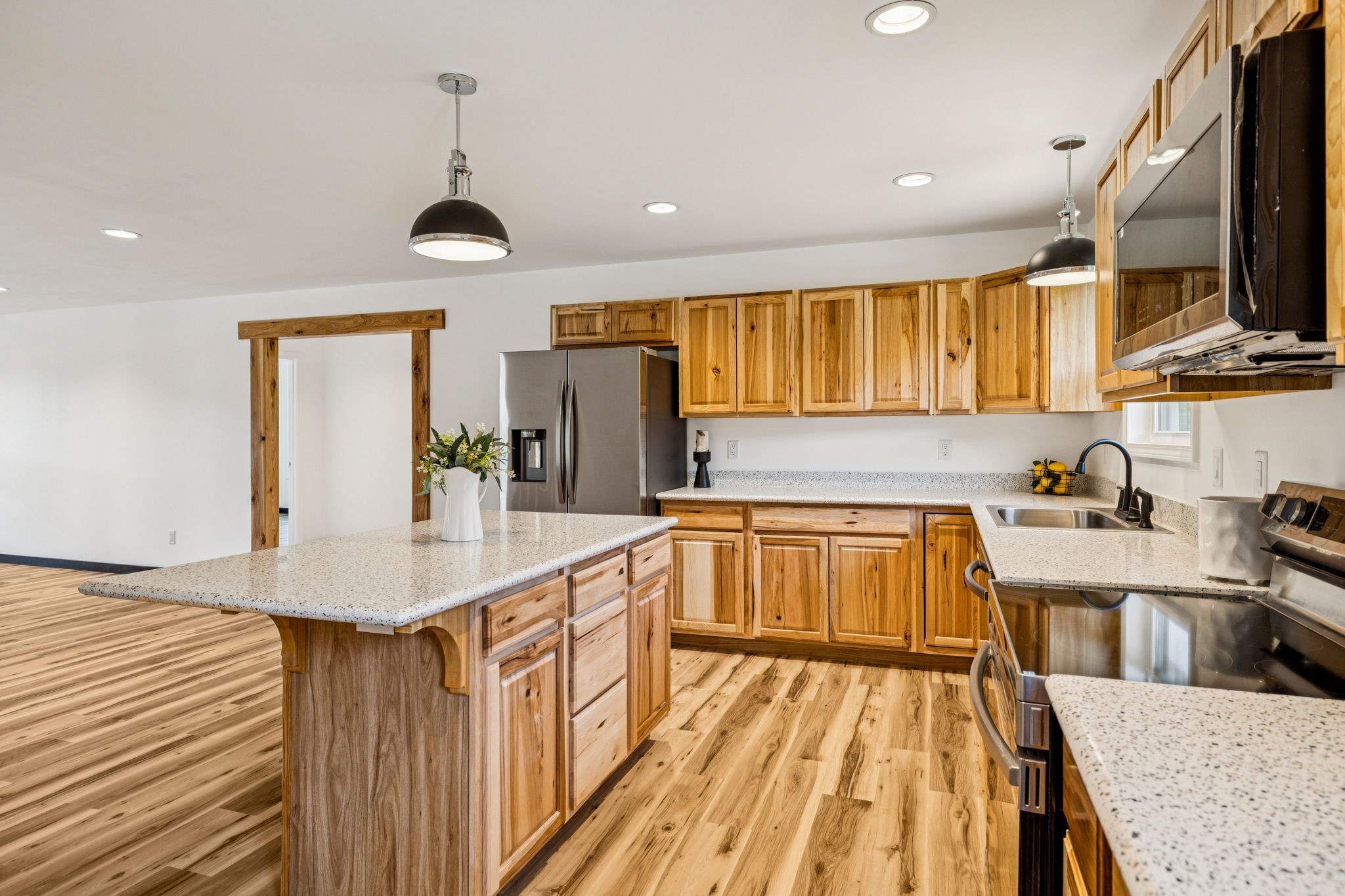 233 Ralph Spivey Lane Gainesboro, TN 38562 - Photo 18 of 45 a kitchen with a sink a counter top space stainless steel appliances and cabinets