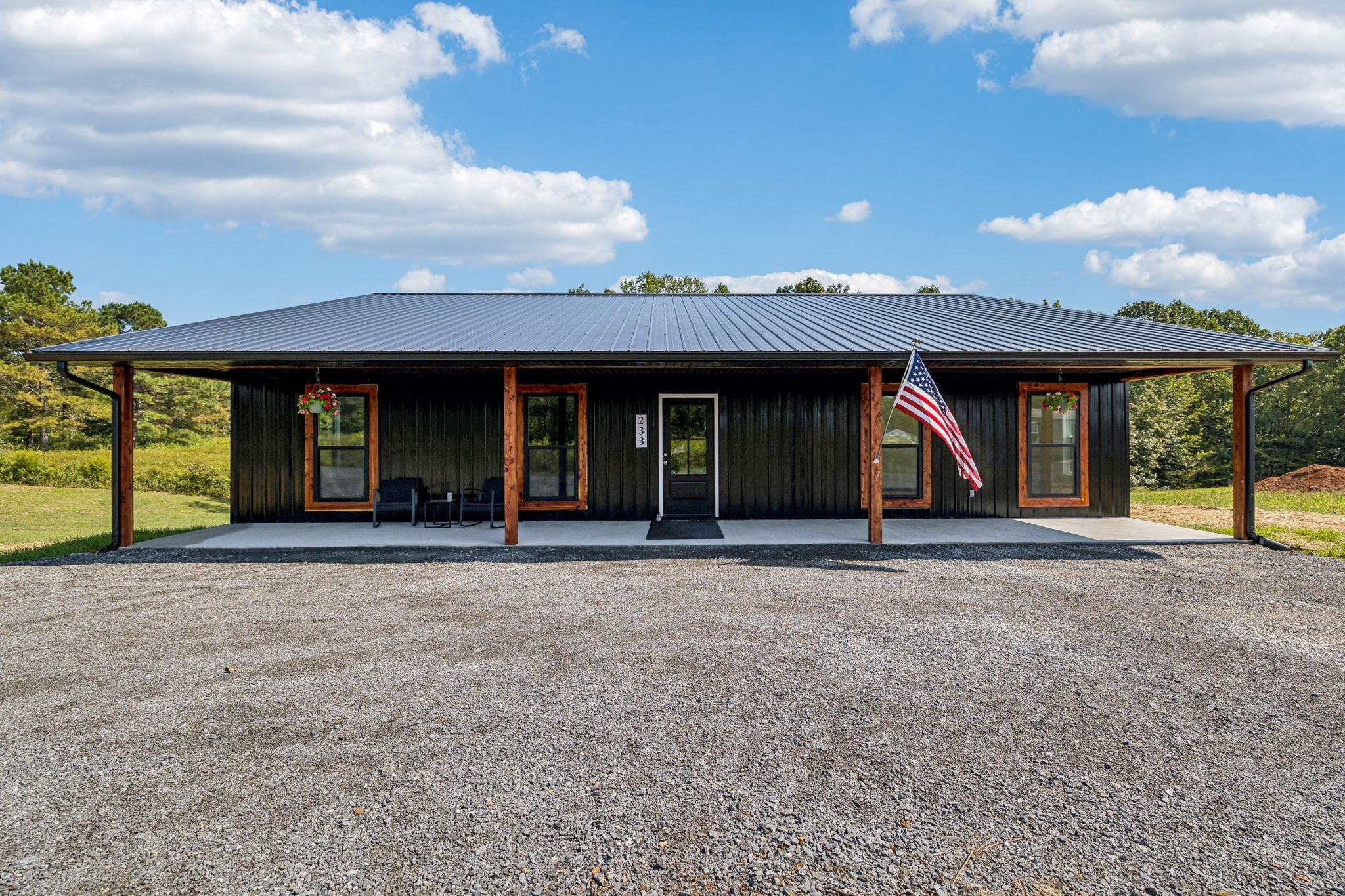 233 Ralph Spivey Lane Gainesboro, TN 38562 - Photo 2 of 45 front view of a house with a garden