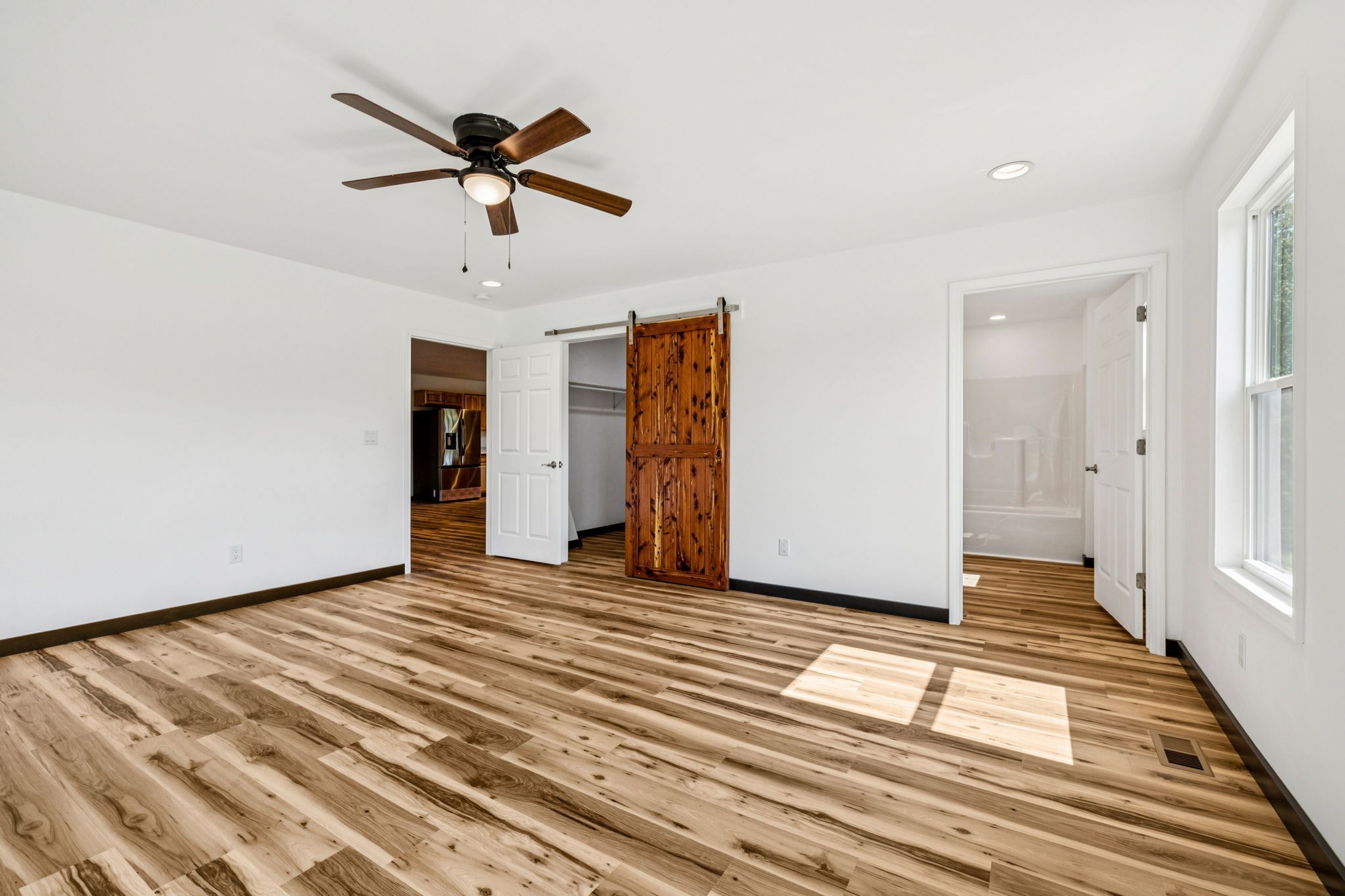 233 Ralph Spivey Lane Gainesboro, TN 38562 - Photo 23 of 45 a view of a livingroom with wooden floor and white walls