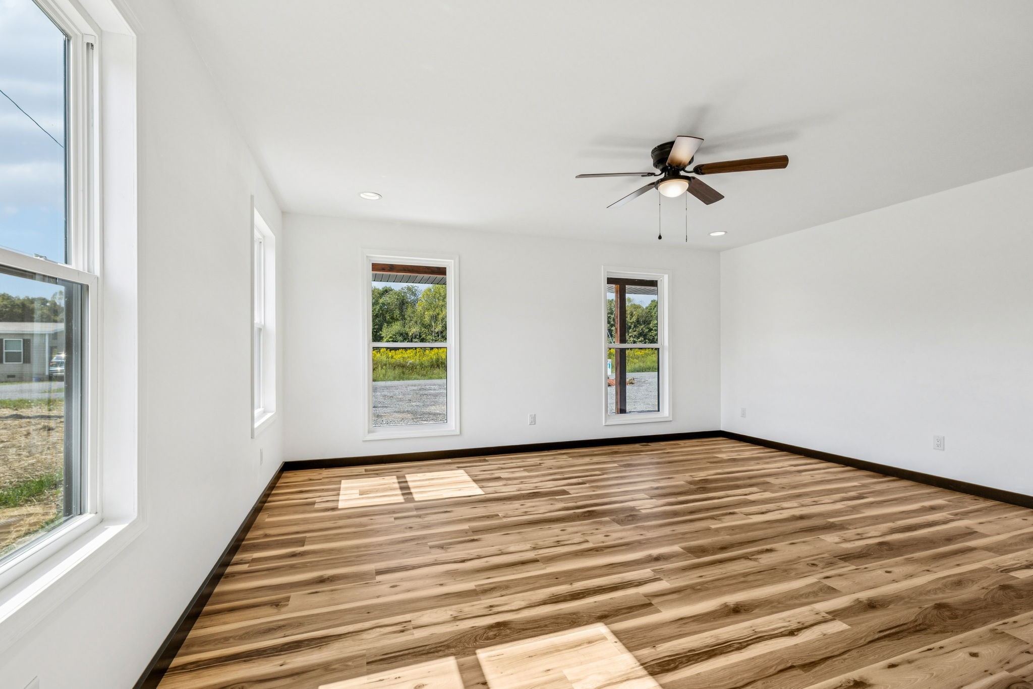 233 Ralph Spivey Lane Gainesboro, TN 38562 - Photo 24 of 45 a view of empty room with wooden floor and fan