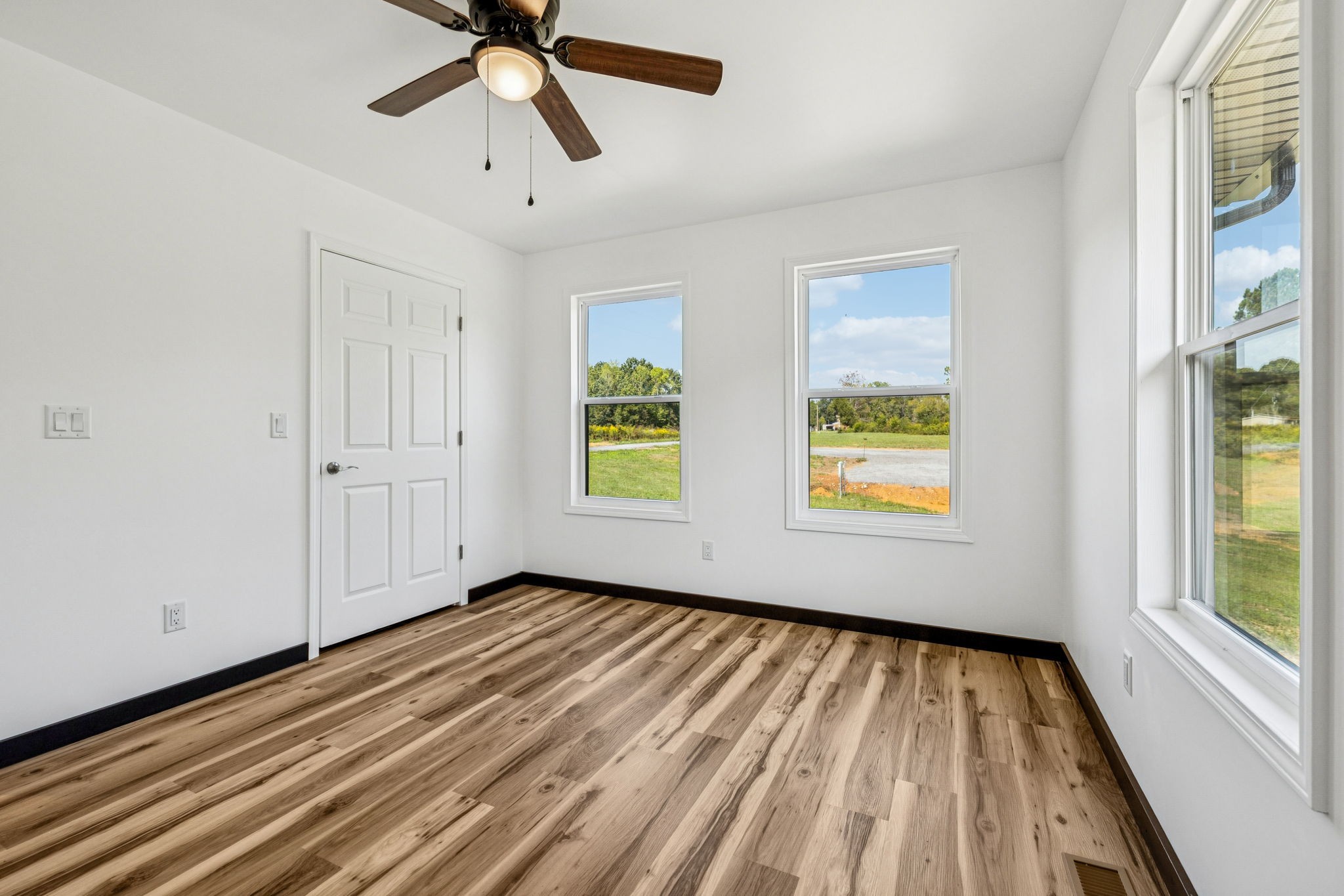 233 Ralph Spivey Lane Gainesboro, TN 38562 - Photo 30 of 45 a view of empty room with wooden floor and fan