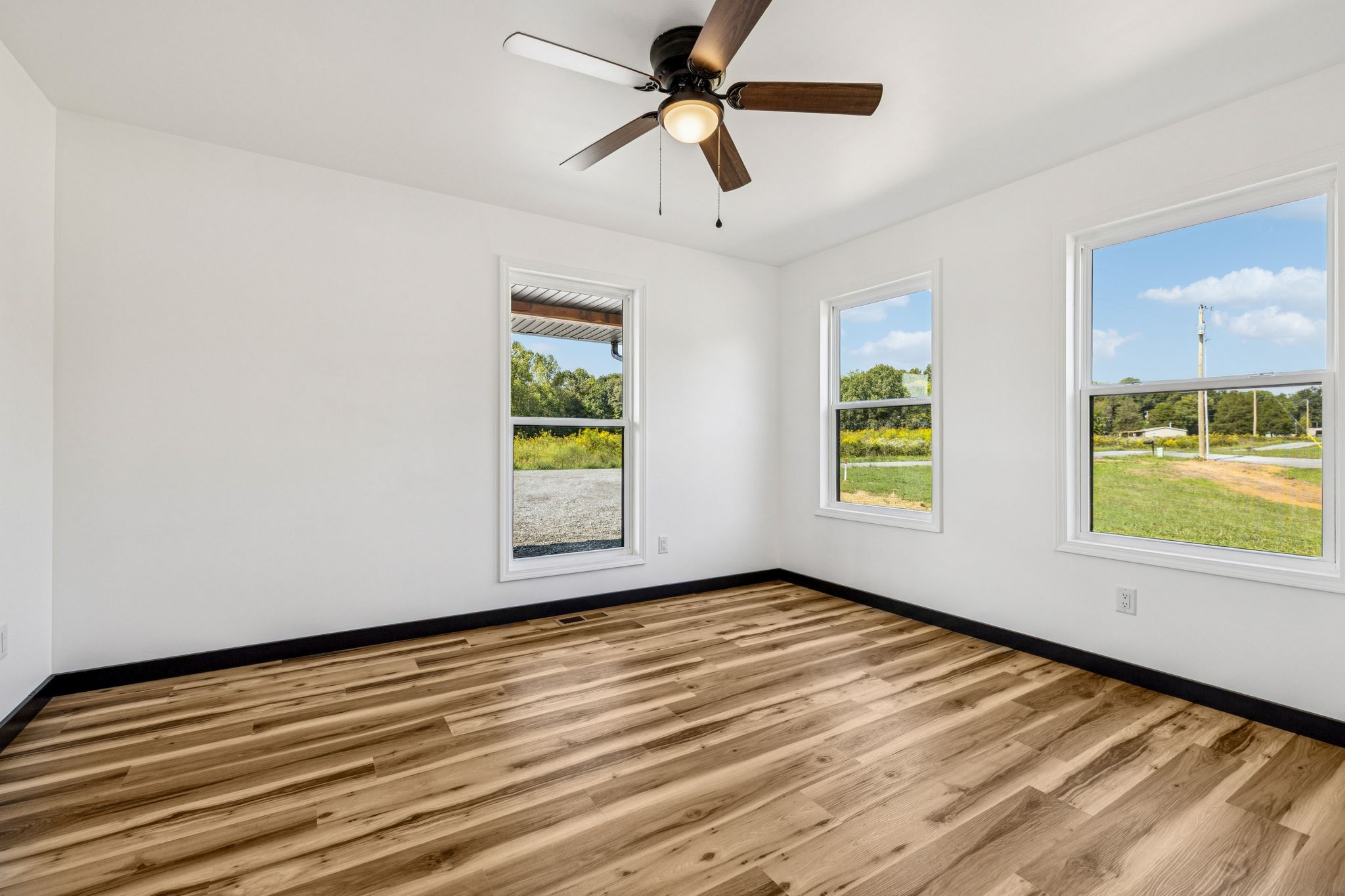 233 Ralph Spivey Lane Gainesboro, TN 38562 - Photo 33 of 45 wooden floor in an empty room with a window