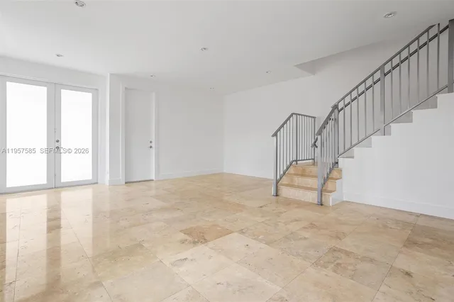 a view of an empty room with stairs