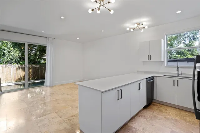 a view of cabinets and window