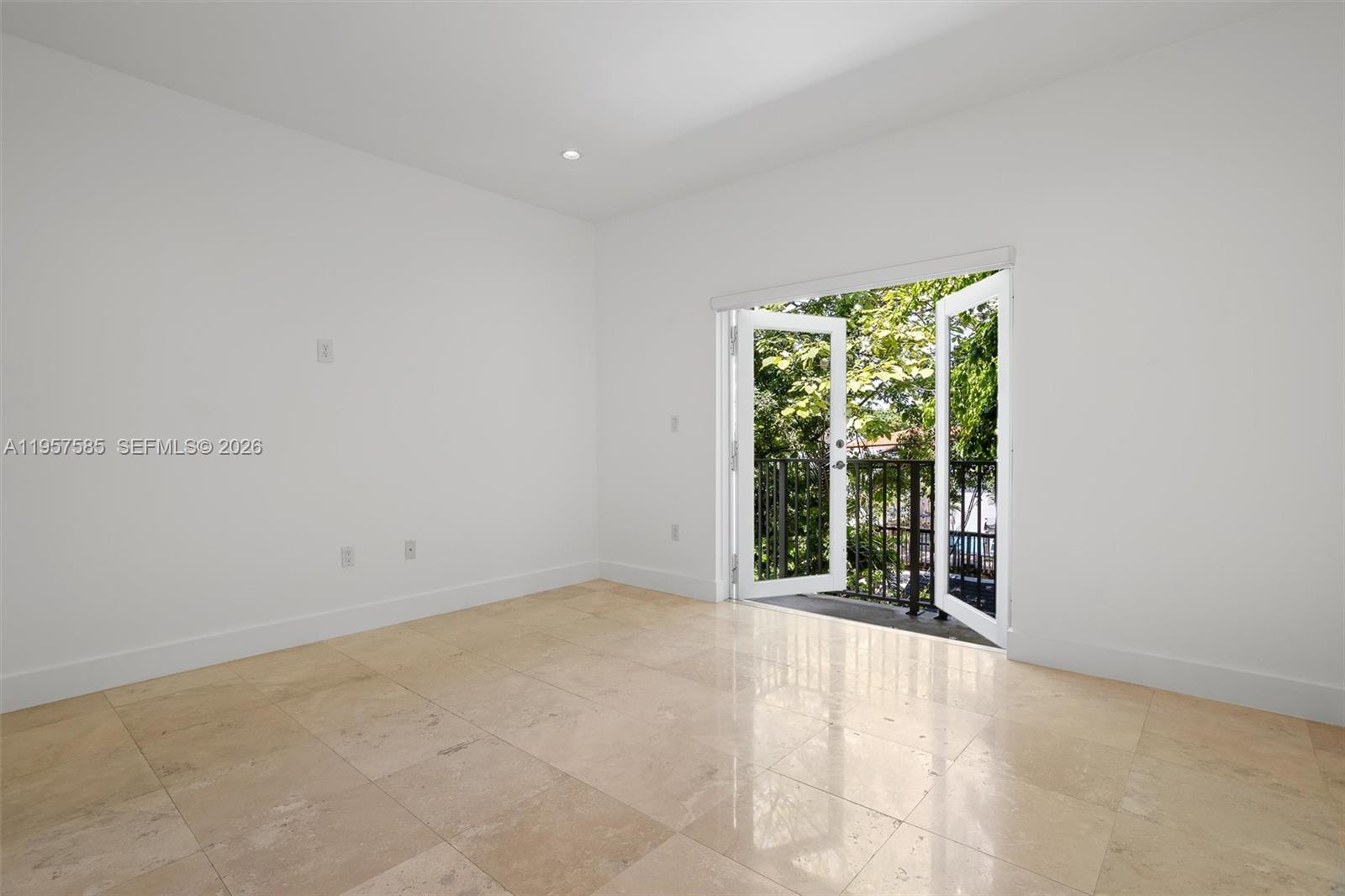 2784 Southwest 34th Avenue Miami, FL 33133 - Photo 21 of 45 an empty room with large windows