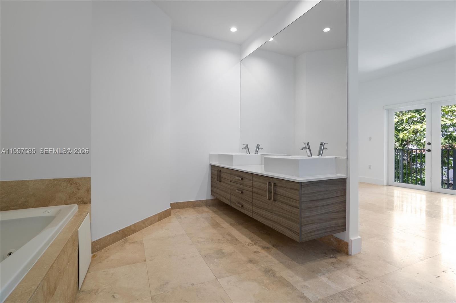 2784 Southwest 34th Avenue Miami, FL 33133 - Photo 22 of 45 a bathroom with a sink and a bathtub