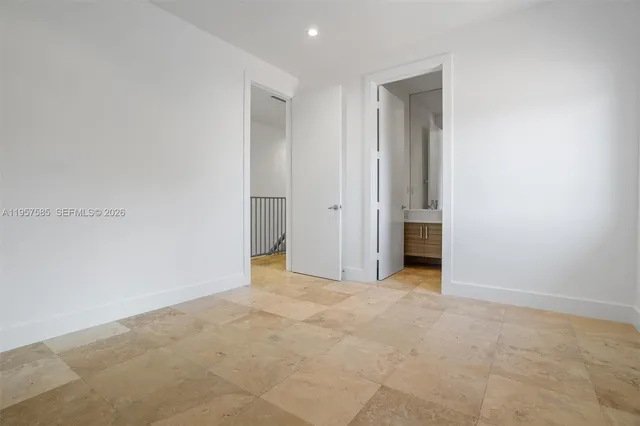 a view of an empty room with glass door