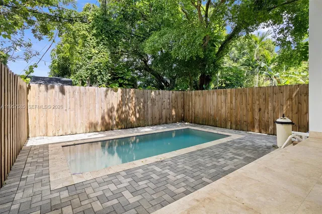a view of outdoor space with swimming pool and patio