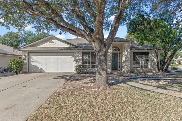 front view of a house with a trees