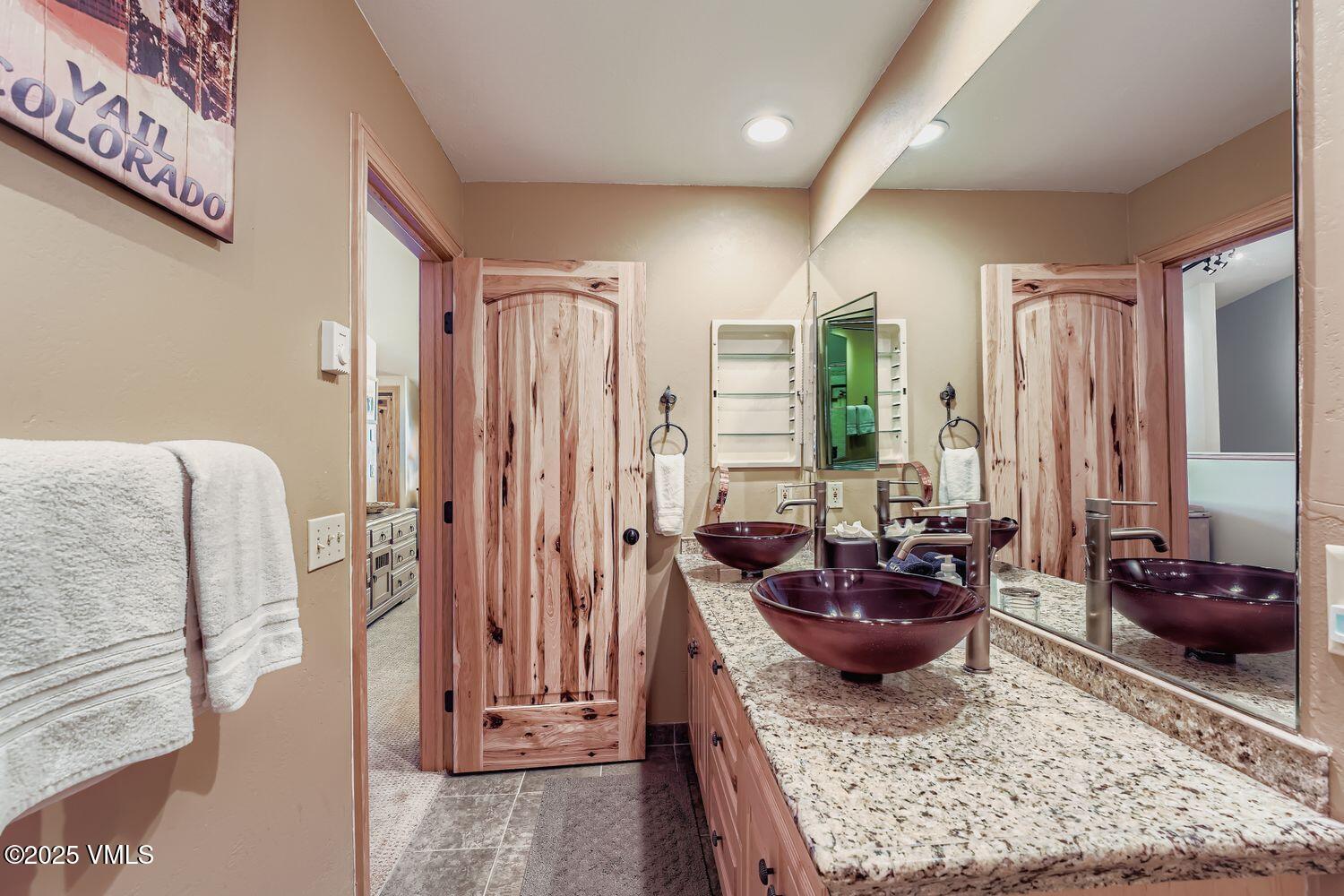 137 Benchmark Road, Unit 520 Avon, CO 81620 - Photo 15 of 26 a living room with furniture and a rug