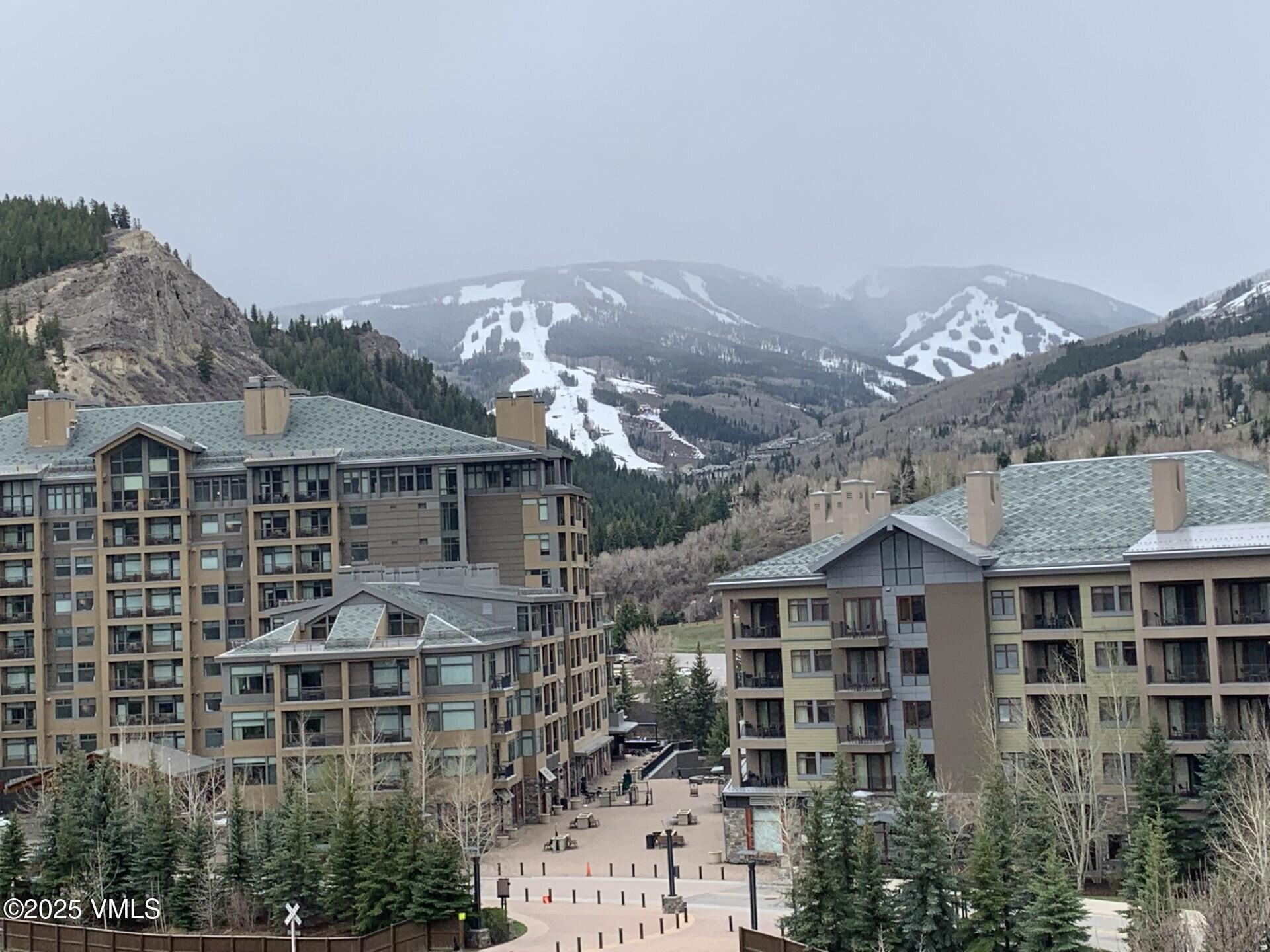 137 Benchmark Road, Unit 520 Avon, CO 81620 - Photo 17 of 26 a front view of a building with many windows