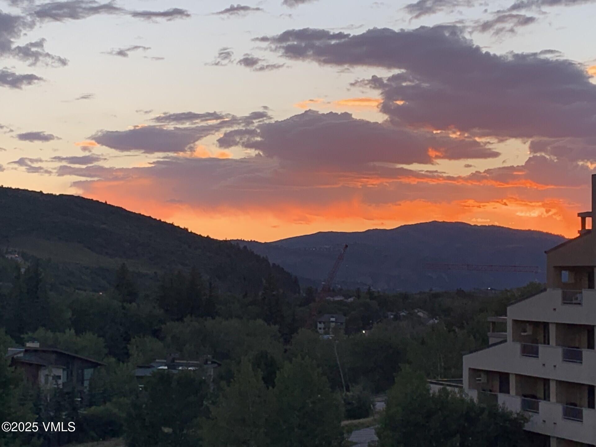 137 Benchmark Road, Unit 520 Avon, CO 81620 - Photo 22 of 26 a view of a town with mountains in the background