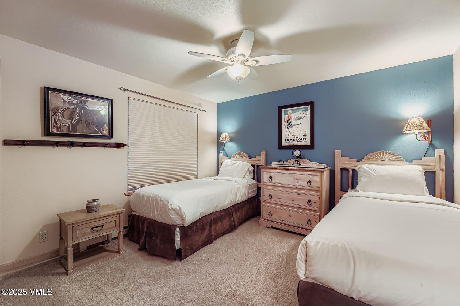 137 Benchmark Road, Unit 520 Avon, CO 81620 - Photo 7 of 26 a bedroom with a bed and furniture