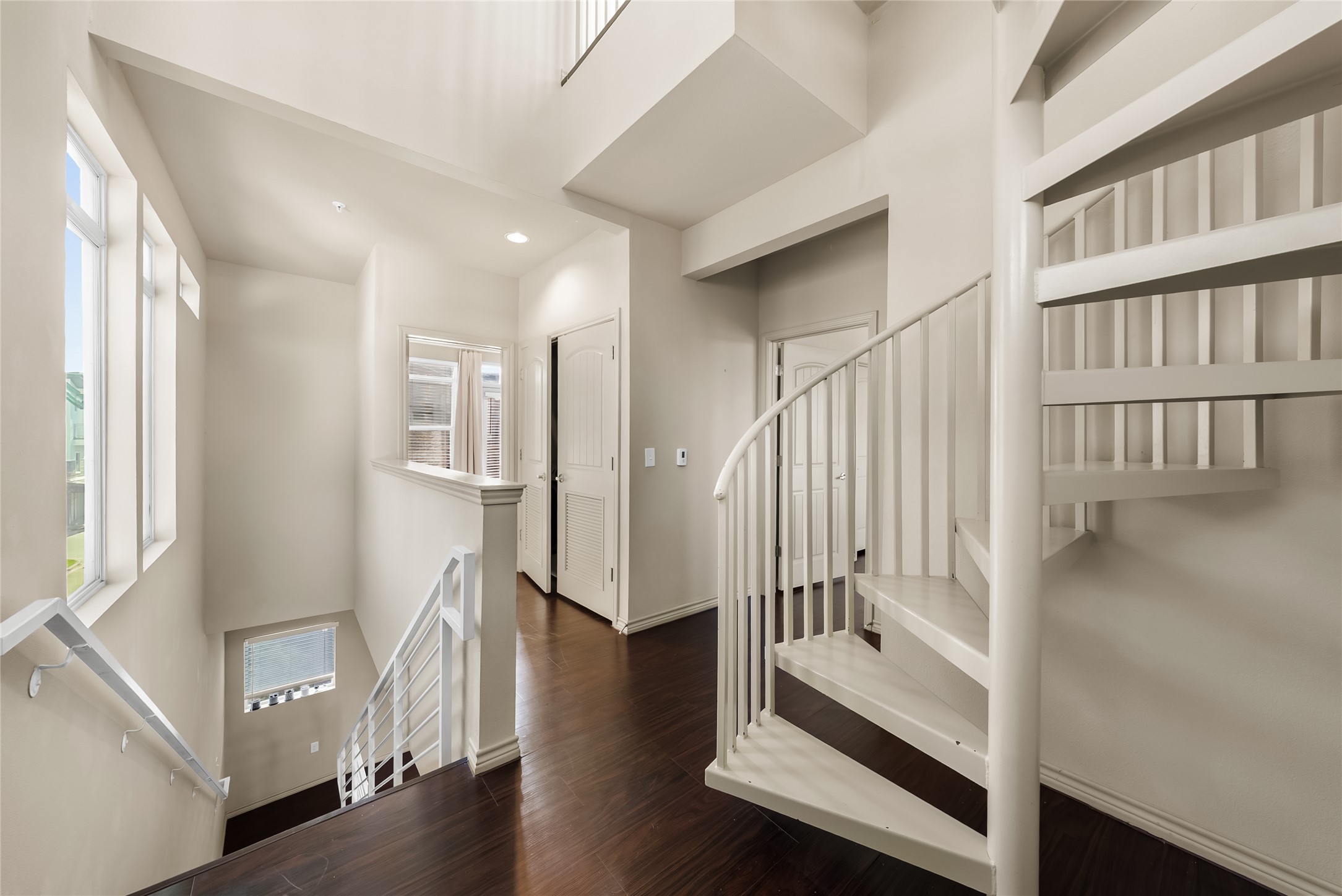 2606 Wilson Street, Unit 901 Austin, TX 78704 - Photo 14 of 37 a view of an entryway with wooden floor and windows