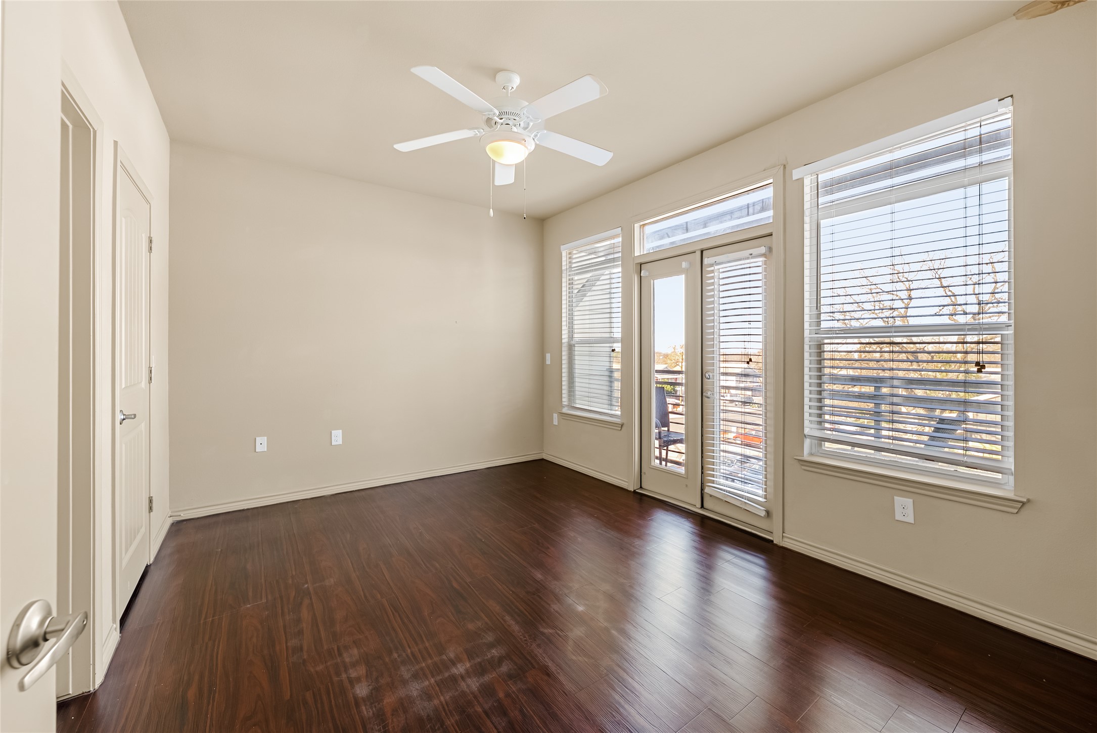 2606 Wilson Street, Unit 901 Austin, TX 78704 - Photo 16 of 37 an empty room with wooden floor and windows