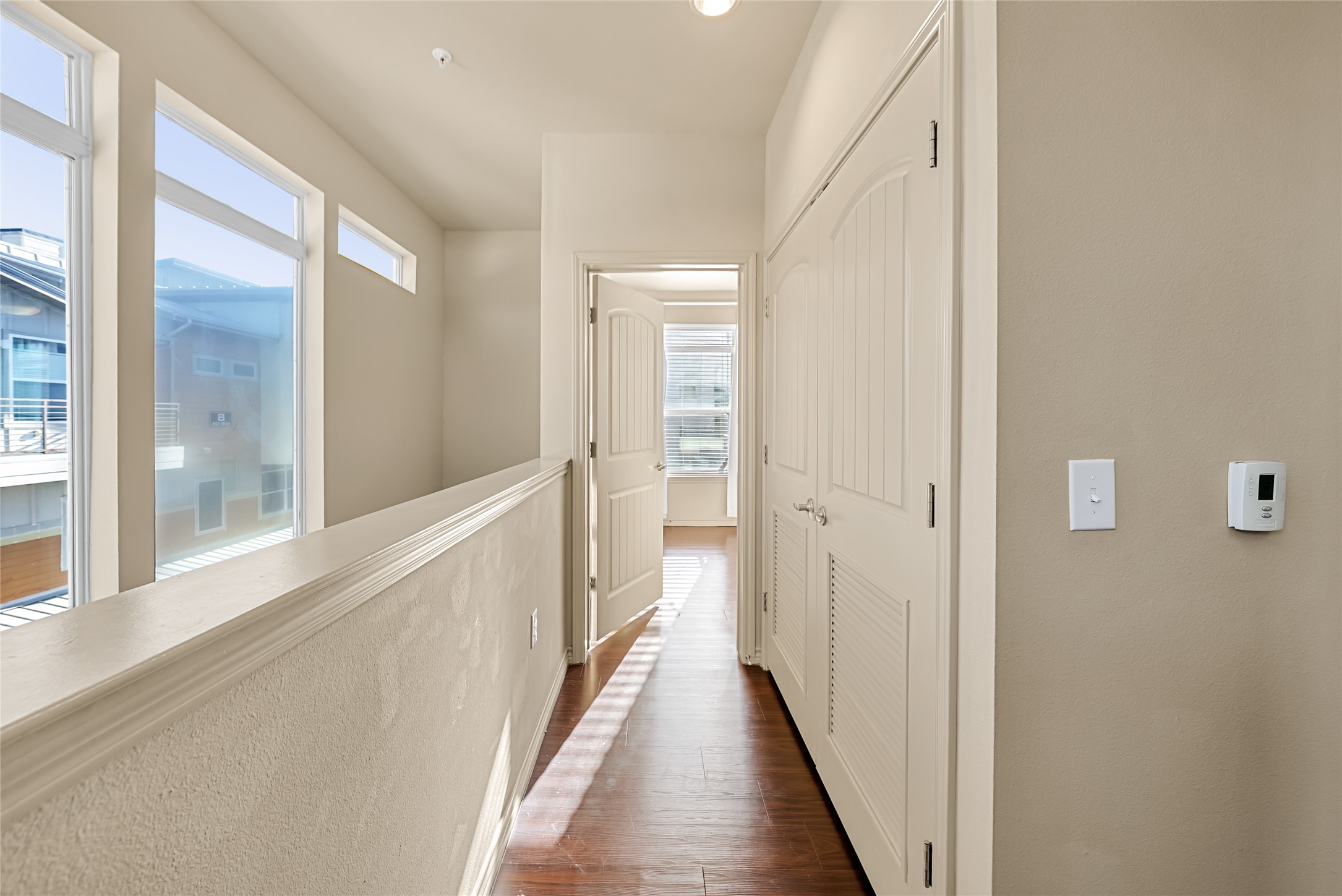 2606 Wilson Street, Unit 901 Austin, TX 78704 - Photo 19 of 37 a view of a hallway with wooden floor and staircase