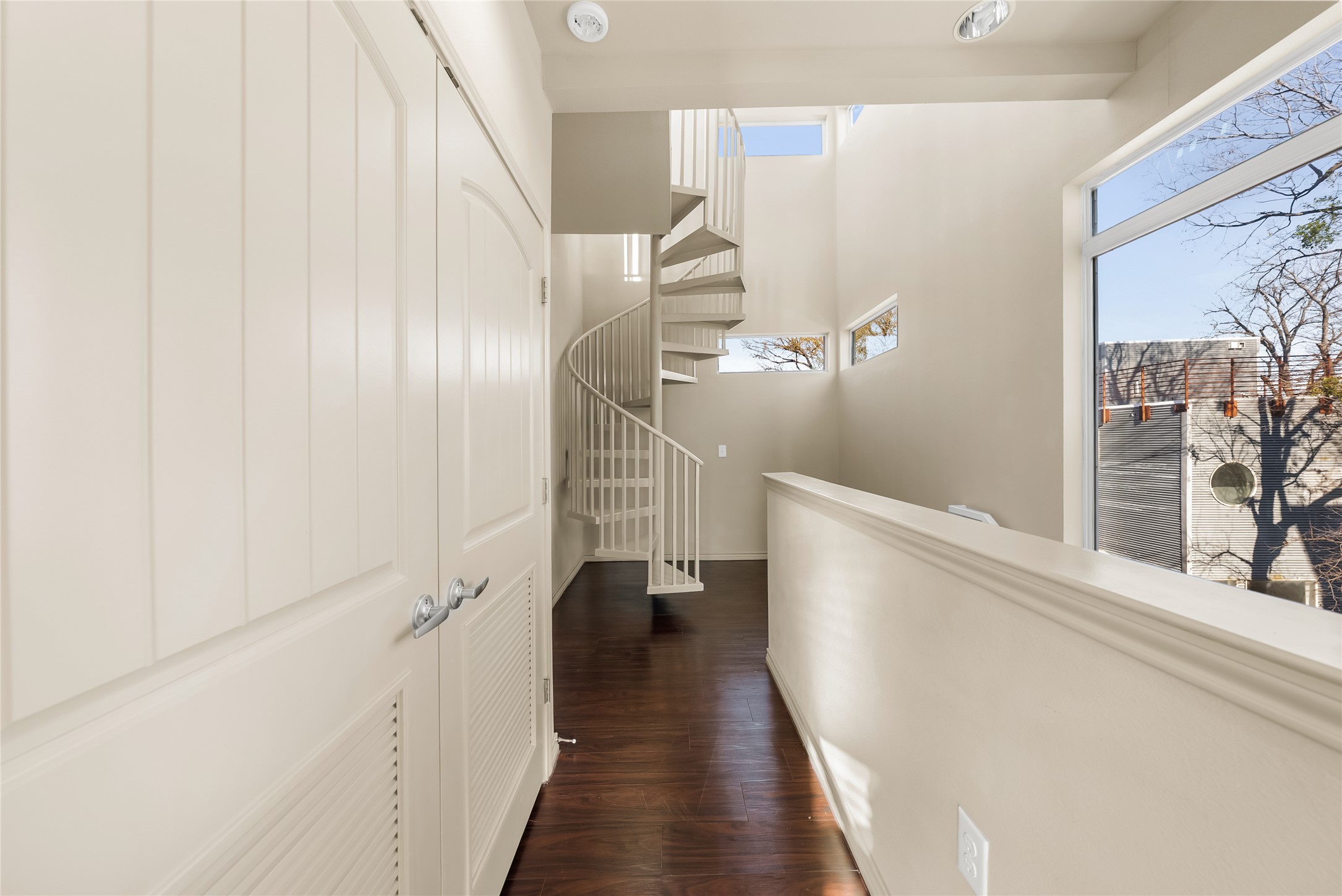 2606 Wilson Street, Unit 901 Austin, TX 78704 - Photo 20 of 37 a view of a hallway with wooden floor and staircase