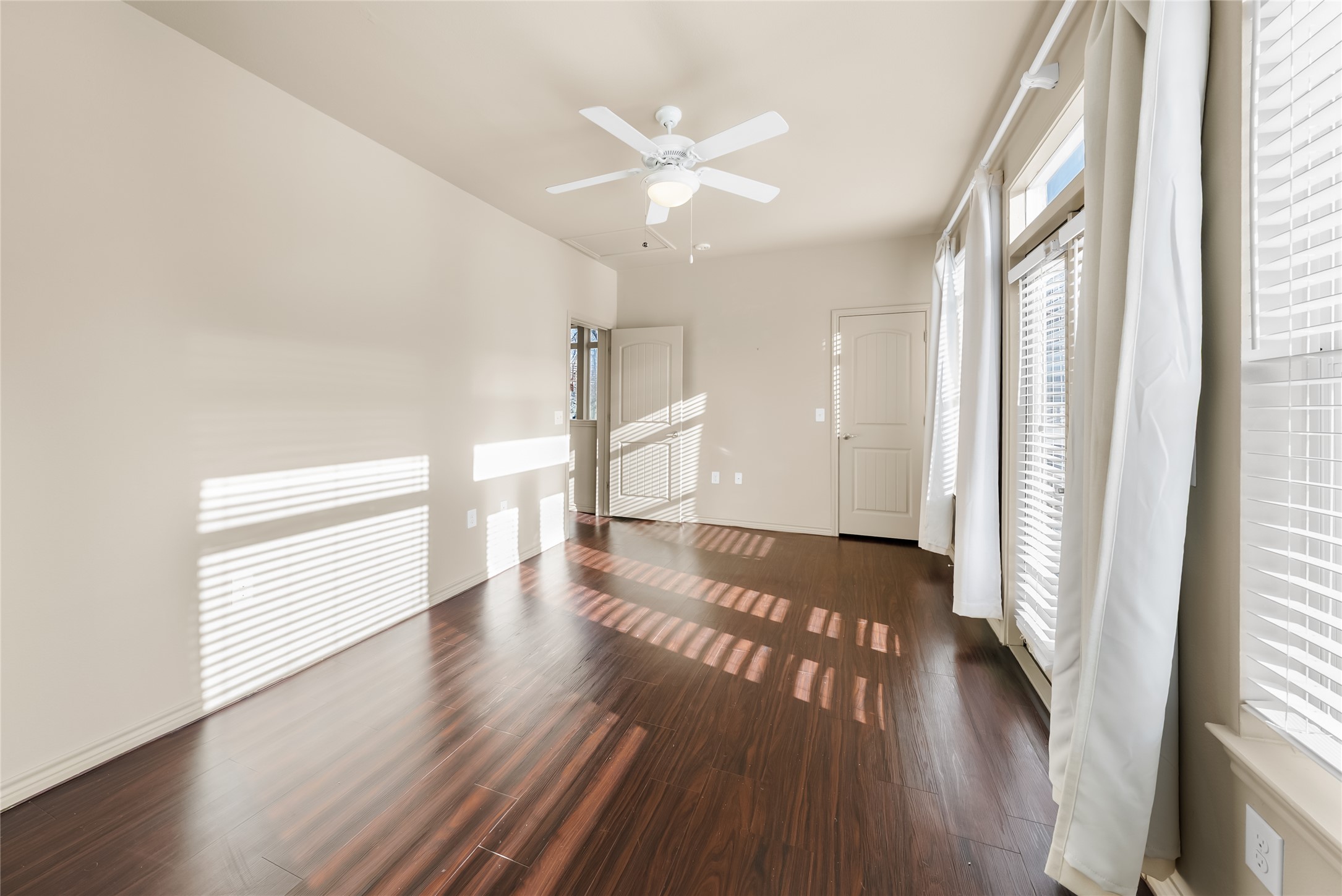 2606 Wilson Street, Unit 901 Austin, TX 78704 - Photo 22 of 37 a view of an empty room with wooden floor and a window