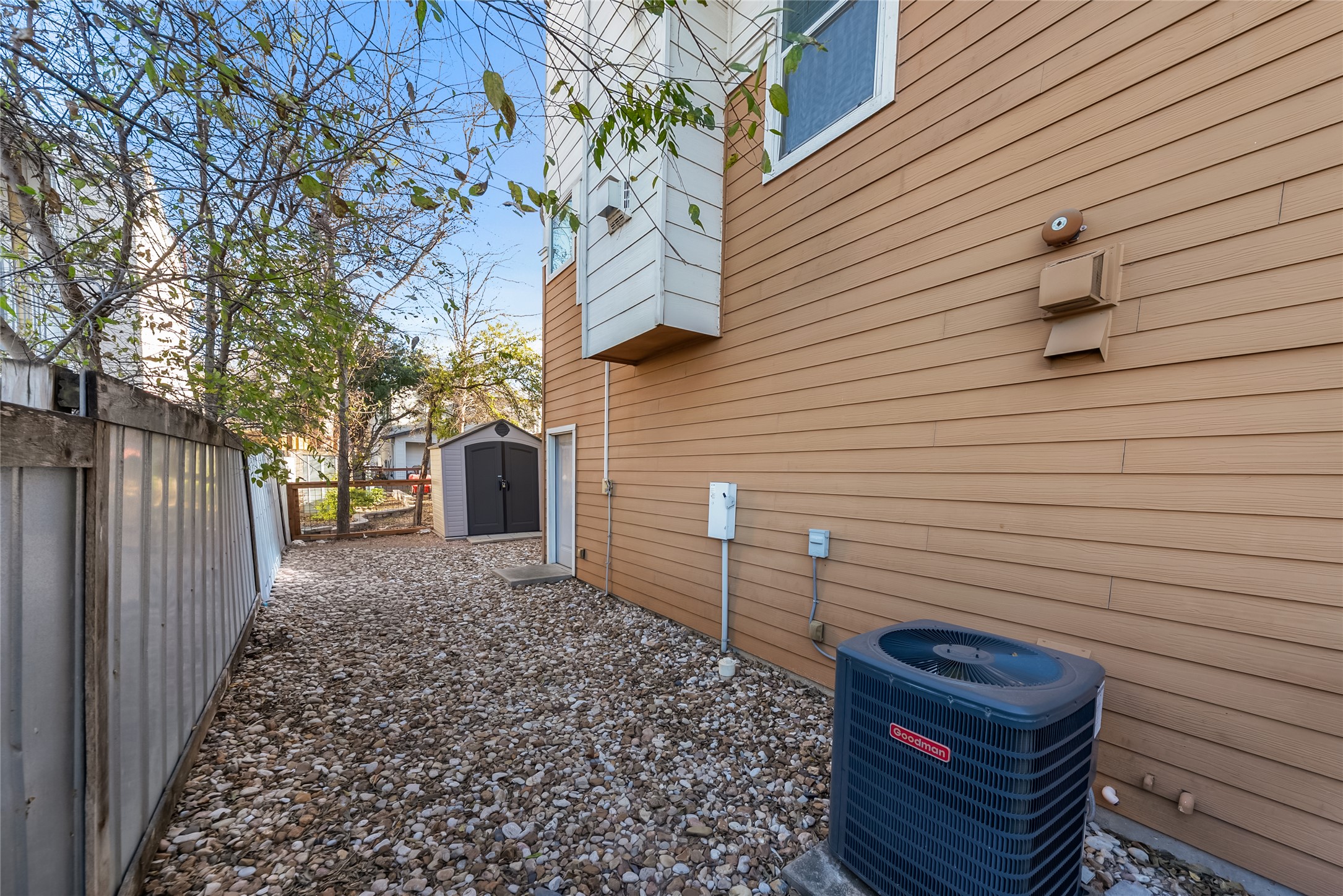 2606 Wilson Street, Unit 901 Austin, TX 78704 - Photo 27 of 37 a view of a backyard with chairs and wooden fence