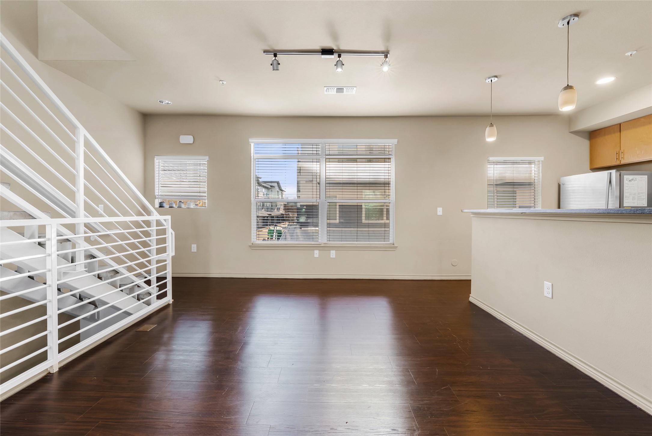 2606 Wilson Street, Unit 901 Austin, TX 78704 - Photo 8 of 37 an empty room with wooden floor and windows