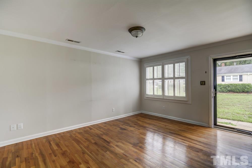 2325 Bernard Street, Unit 2325 Raleigh, NC 27608 - Photo 3 of 10 a view of empty room with wooden floor and fan