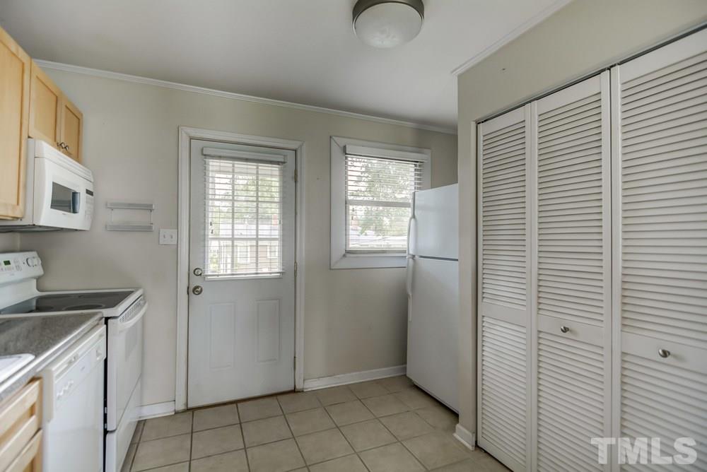 2325 Bernard Street, Unit 2325 Raleigh, NC 27608 - Photo 6 of 10 a view of an empty room with window and cabinet