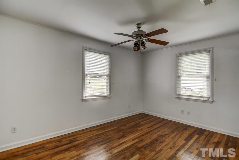 2325 Bernard Street, Unit 2325 Raleigh, NC 27608 - Photo 8 of 10 a view of empty room with wooden floor and fan