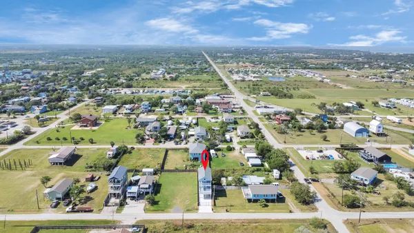 an aerial view of a houses with outdoor space