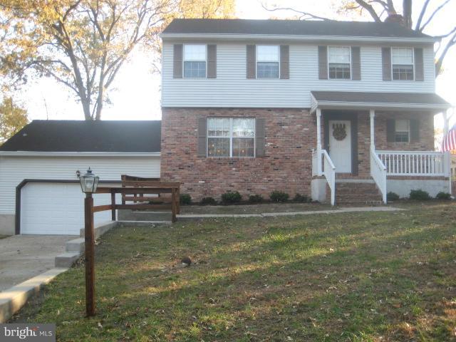 705 Sycamore Leaf Road Severn, MD 21144 - Photo 1 of 18 a front view of a house with garden