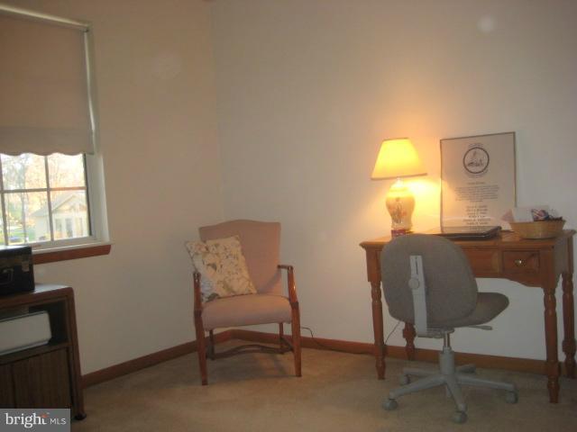 705 Sycamore Leaf Road Severn, MD 21144 - Photo 17 of 18 a view of a workspace with furniture and a window